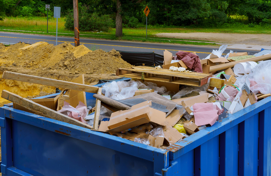 Dumpster filled with trash and debris
